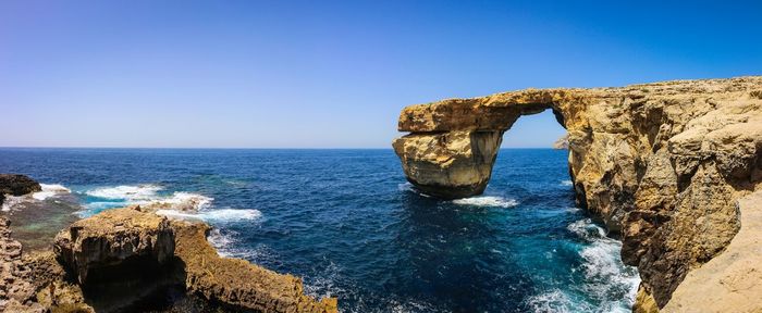 Azure window rock formation against blue sky