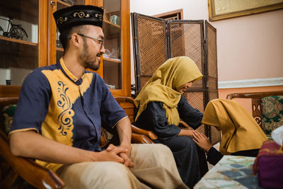 Family sitting at home during festival