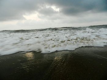 Scenic view of beach against sky