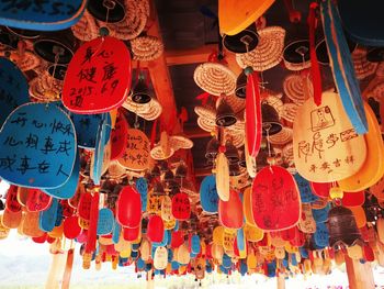 Low angle view of lanterns hanging at market stall