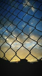 Chainlink fence seen through chainlink fence