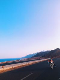 Scenic view of sea against clear blue sky