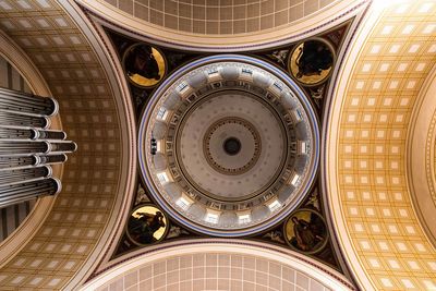 Directly below shot of illuminated ceiling of building