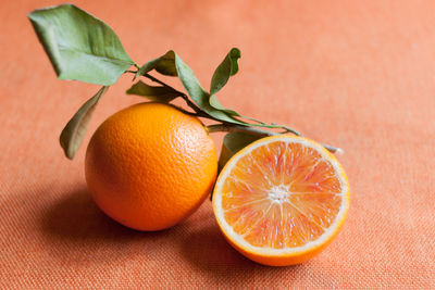 High angle view of fresh organic orange on table