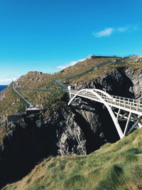 Arch bridge over land against sky