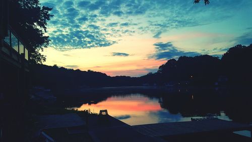 Scenic view of river at sunset