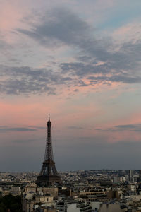 Eiffel tower against sky during sunset