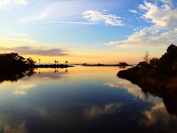 Scenic view of lake at sunset