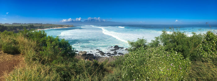 Scenic view of sea against blue sky