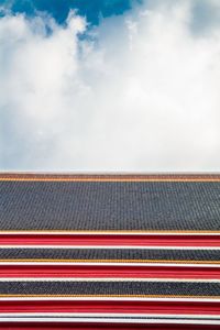 Low angle view of multi colored roof against sky