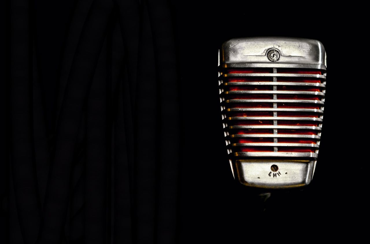 indoors, hanging, still life, single object, close-up, wall - building feature, electricity, red, studio shot, lighting equipment, no people, illuminated, dark, man made object, home interior, curtain, copy space, wall, old-fashioned, pattern