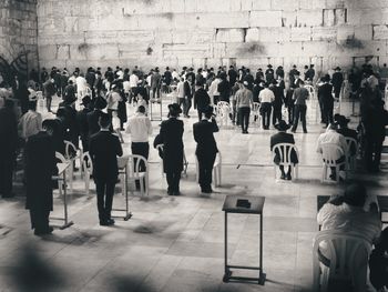 Rear view of people walking in corridor