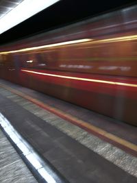 Blurred motion of train at railroad station platform