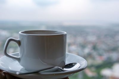 Close-up of coffee cup on table