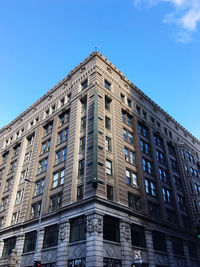Low angle view of building against clear blue sky