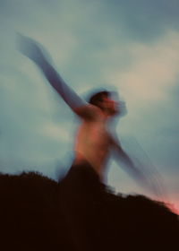 Side view of silhouette woman dancing against sky during sunset