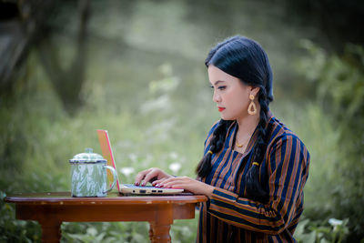 Young woman using mobile phone