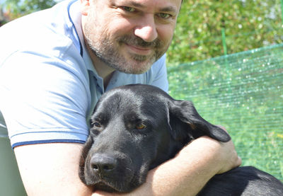 Portrait of man with dog