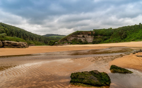 Scenic view of beach against sky