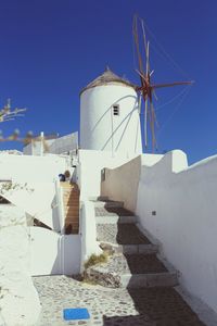 Traditional windmill against clear blue sky