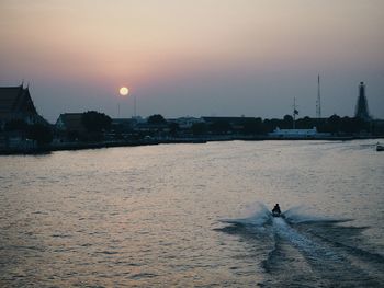 Scenic view of sea against clear sky during sunset