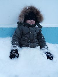 Child playing outdoors in winter