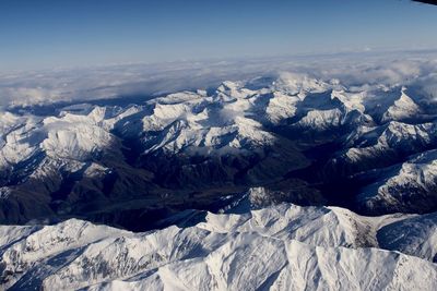 Scenic view of mountains against sky during winter