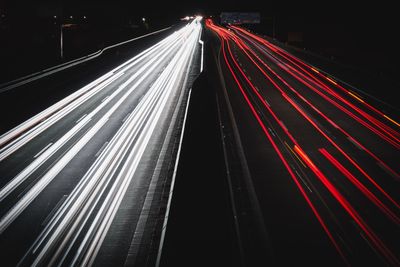 Light trails on suspension bridge at night