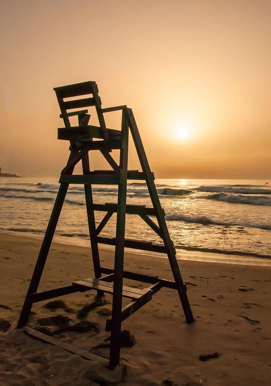 LIFEGUARD HUT ON SHORE DURING SUNSET