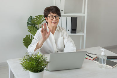 Businesswoman working at desk in office