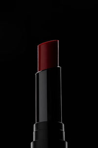 Close-up of bottle against black background