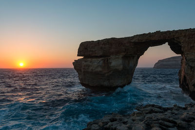 View of calm sea at sunset