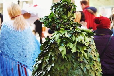 Person wearing leaves costume at carnival