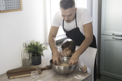 Midsection of father with daughter