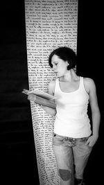Young woman standing with text
