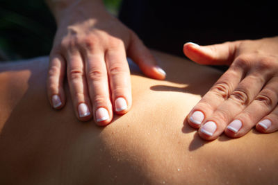 Close-up of people on hands