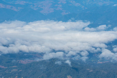 Aerial view of clouds over mountains