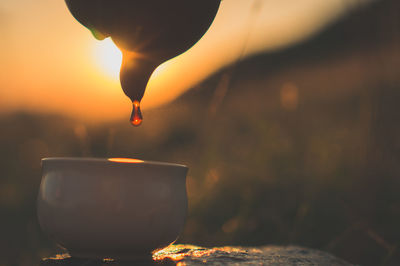 Close-up of burning at sunset