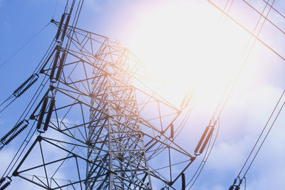 Low angle view of electricity pylon against sky