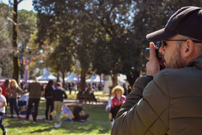 Man photographing with mobile phone