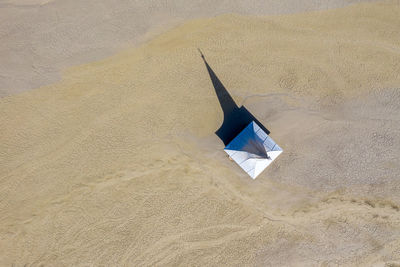 High angle view of umbrella on beach