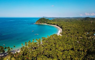 Scenic view of sea against clear blue sky