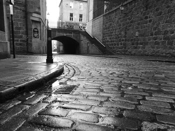 Surface level of narrow footpath leading towards town