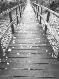 High angle view of wooden footbridge