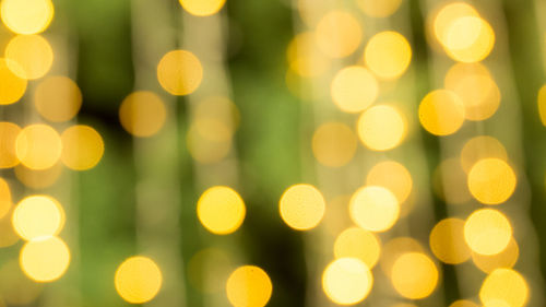 Defocused image of illuminated christmas tree