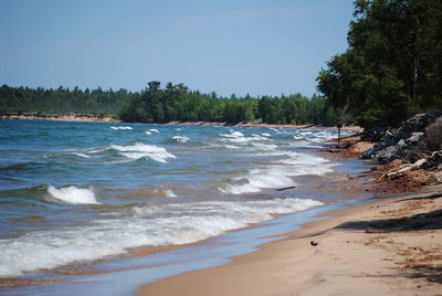 Scenic view of beach against clear sky