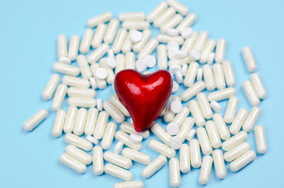 Close-up of heart shape made on white background