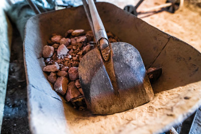 High angle view of gravel with shovel