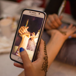 Close-up of woman using mobile phone