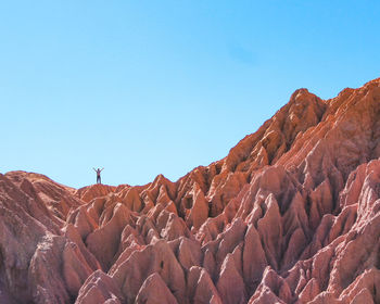 Scenic view of mountains against clear blue sky